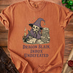 Skeleton wizard writing with feather pen, text "Dragon Slain, Inbox Undefeated."