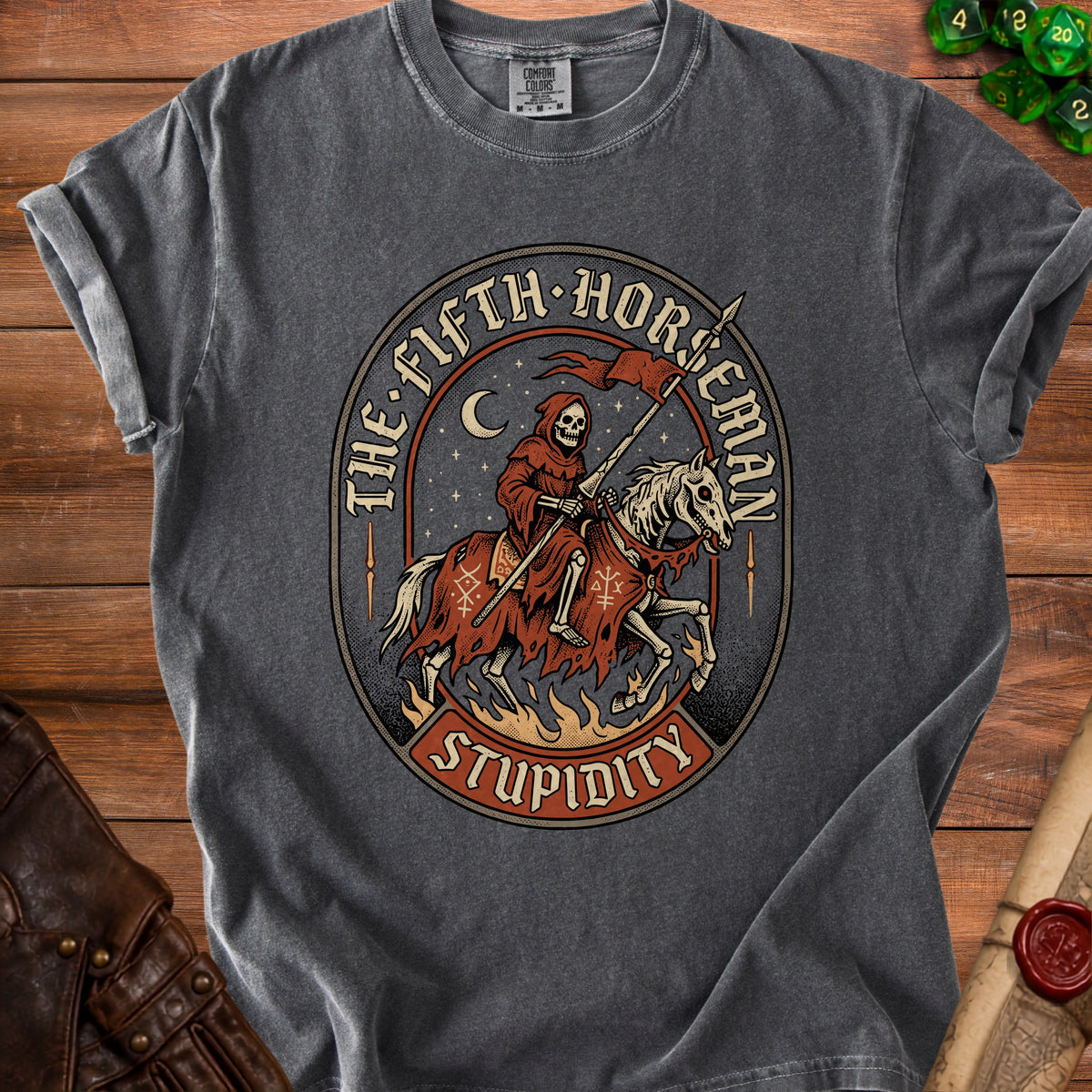 Dark grey t-shirt with a circular graphic of a skeletal grim reaper on a horse, "The Fifth Horseman" and "Stupidity".