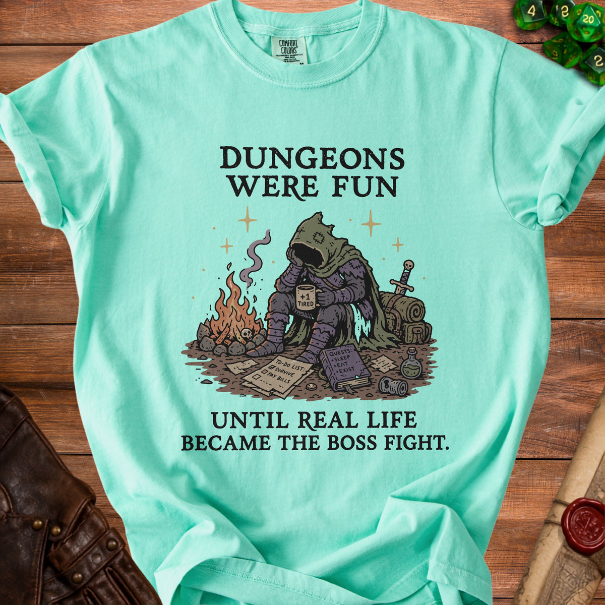 Mint green t-shirt with "Dungeons were fun until real life became the boss fight" text.