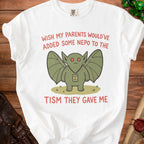White t-shirt with a green creature graphic and text saying "Wish my parents would've added some nepo to the nepotism they gave me."