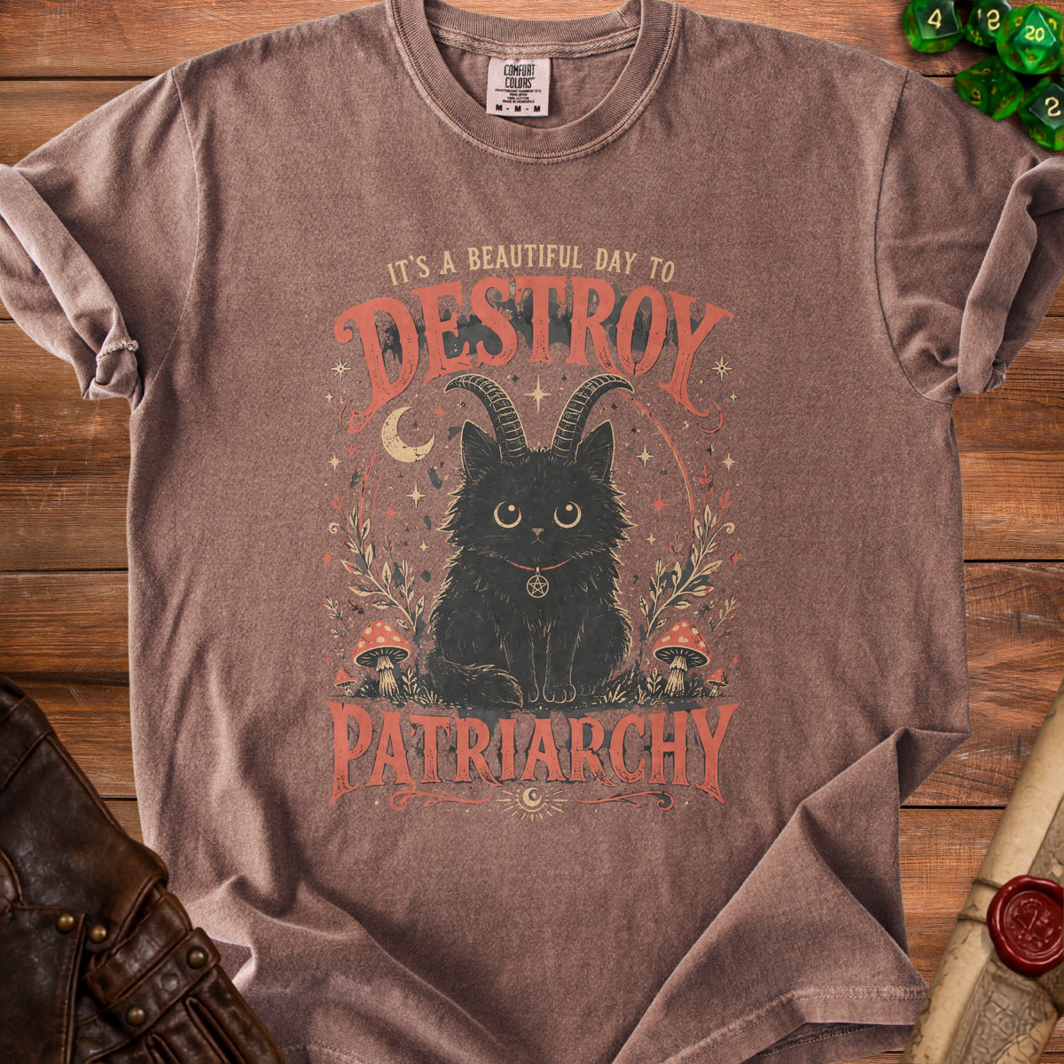 Brown t-shirt with black cat wearing a pentagram and horns, text reads "It's a beautiful day to destroy patriarchy".
