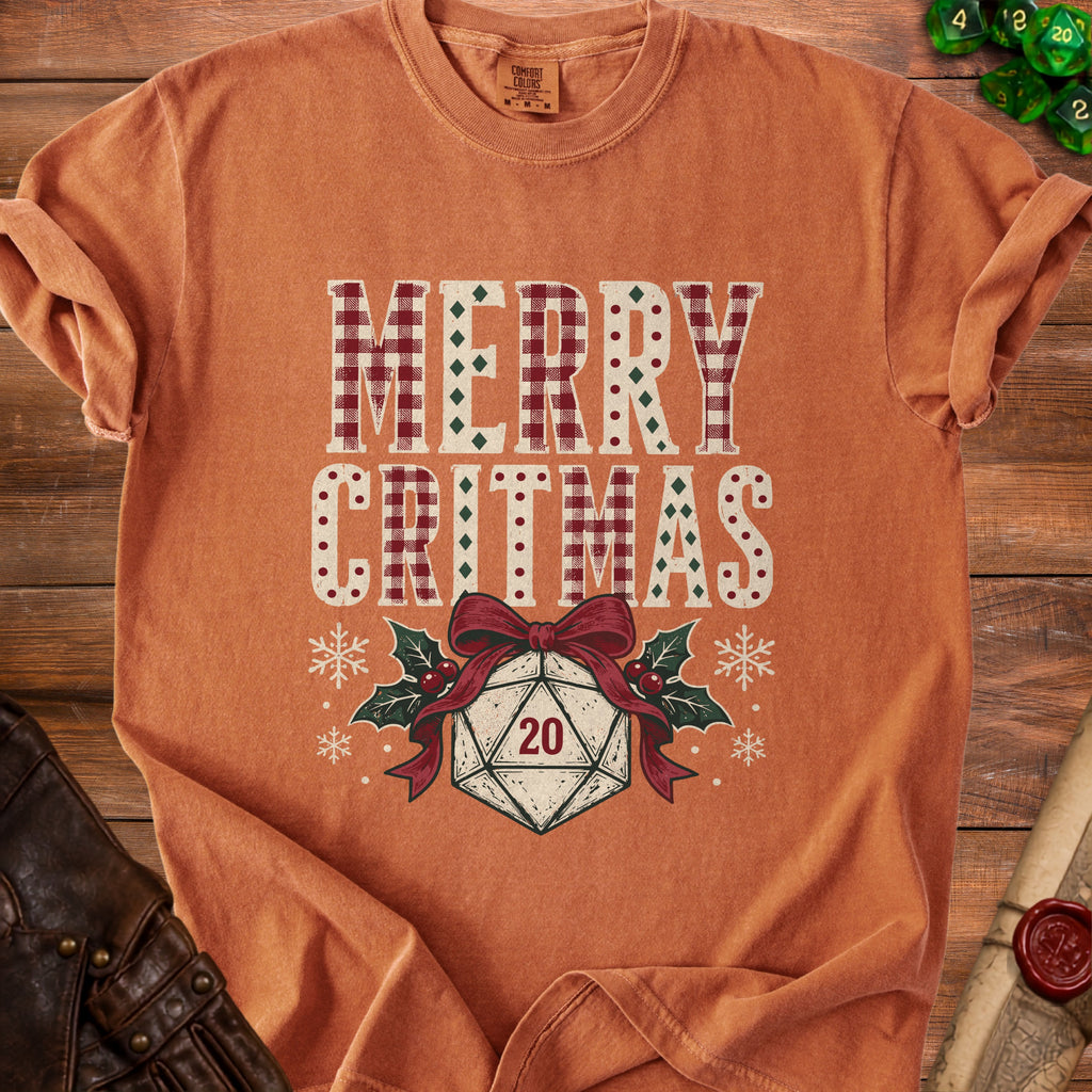 Orange t-shirt with "Merry Critmas" text and a d20 dice and holly.