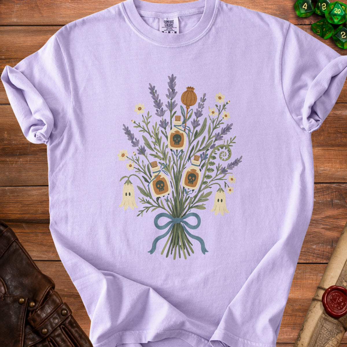 Lavender t-shirt with bouquet of plants, potion bottles, and ghosts graphic.