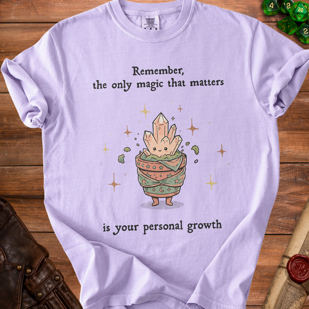 Purple t-shirt with text "Remember, the only magic that matters is your personal growth".
