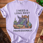 Light purple t-shirt with wizard graphic and text "I NEED A LONG REST PROFESSIONALLY".