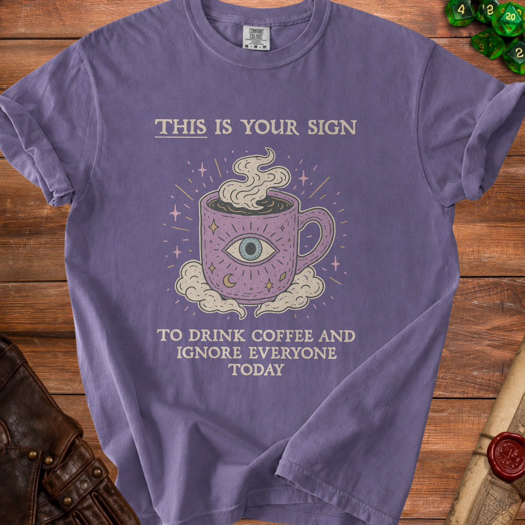 Purple t-shirt with "This is your sign to drink coffee and ignore everyone today" text.