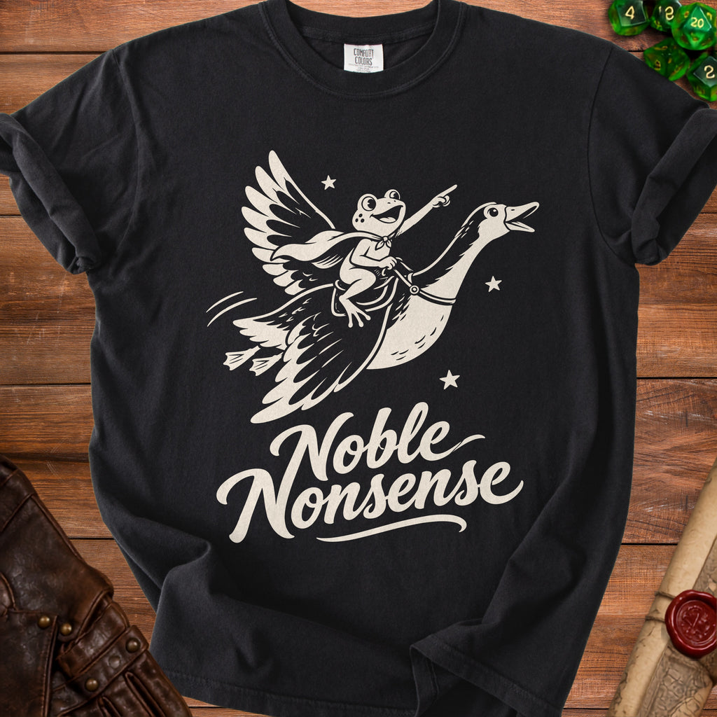 Black t-shirt featuring a vintage white graphic of a frog riding a flying goose with the text "Noble Nonsense".