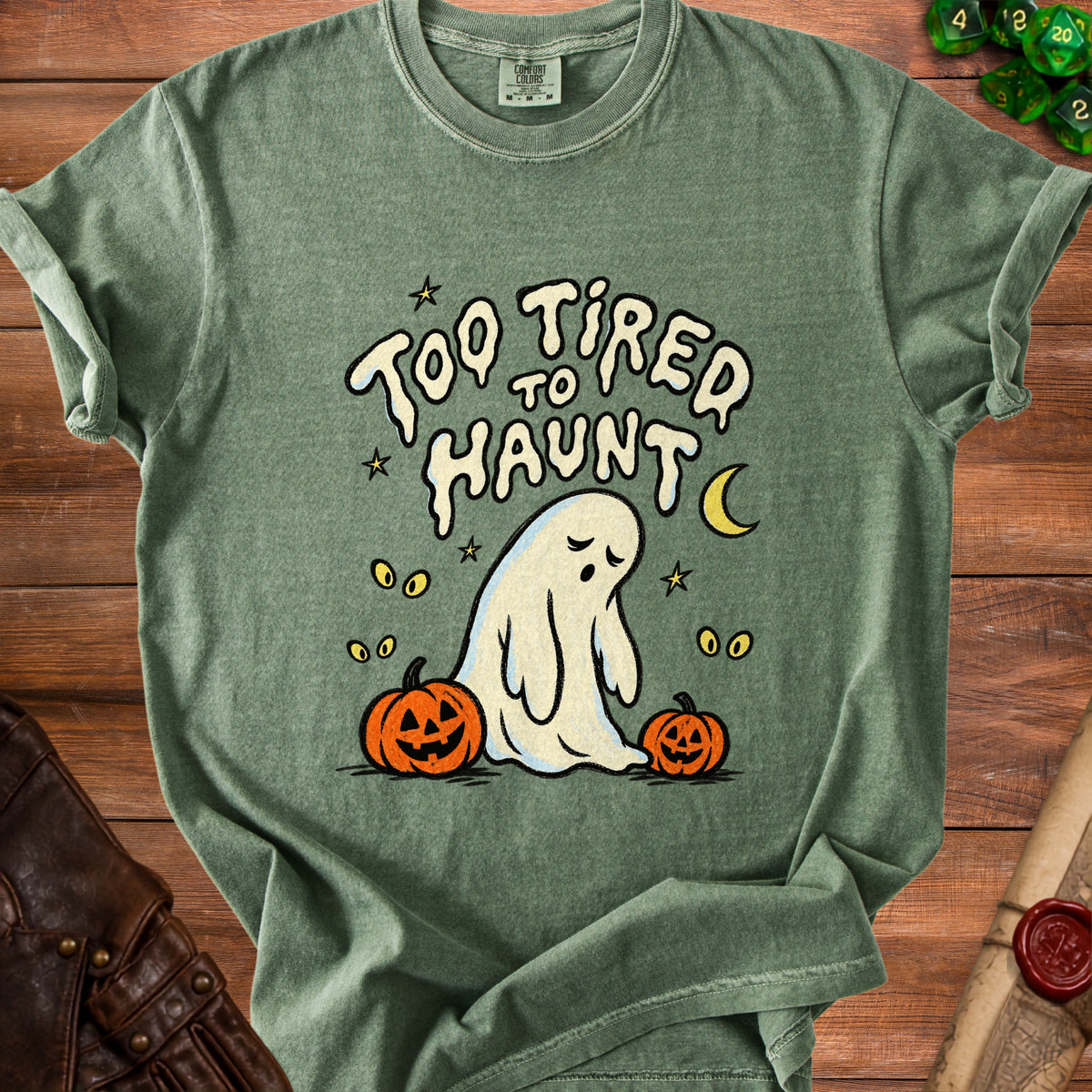 Green t-shirt with "Too Tired To Haunt" text and a ghost with pumpkins.