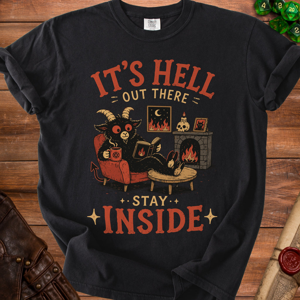Black t-shirt with demon reading and text "It's Hell Out There Stay Inside".