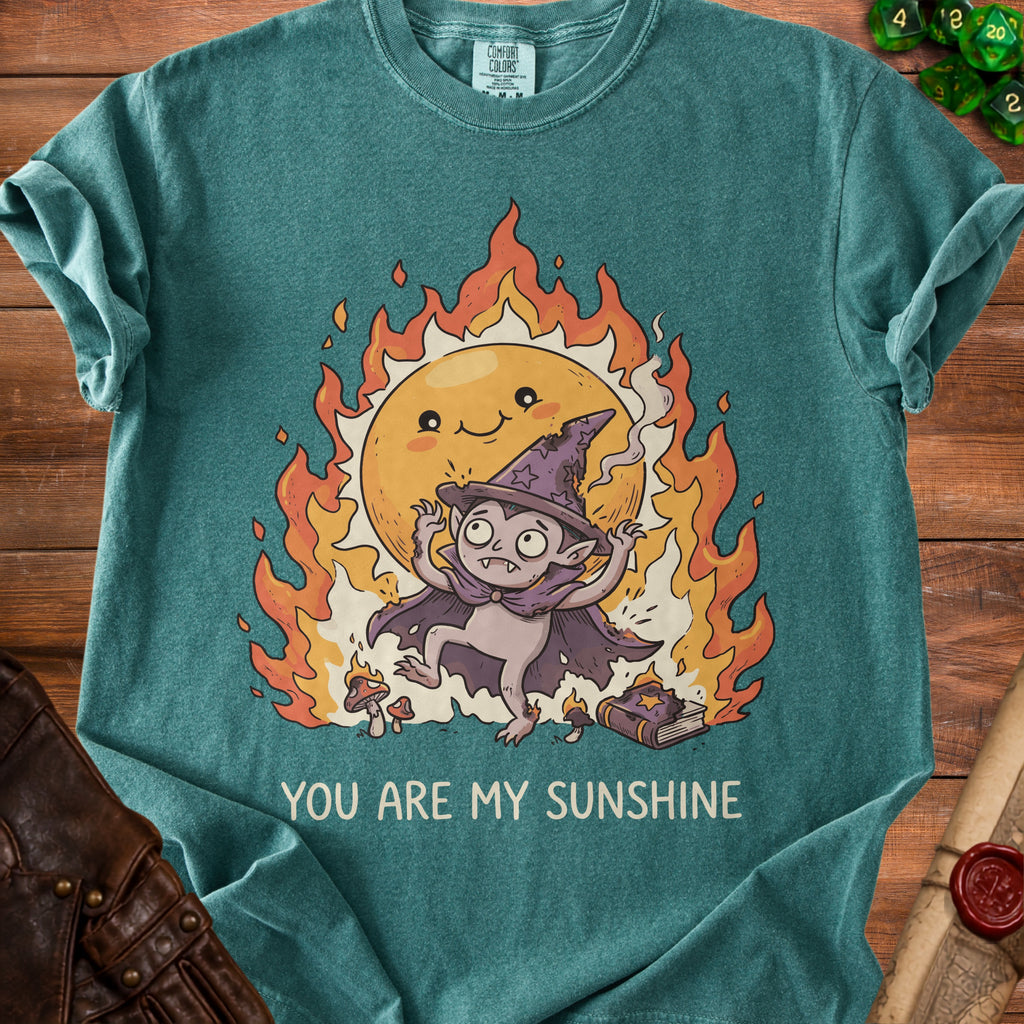 Green t-shirt with illustration of a vampire in flames and text "YOU ARE MY SUNSHINE."