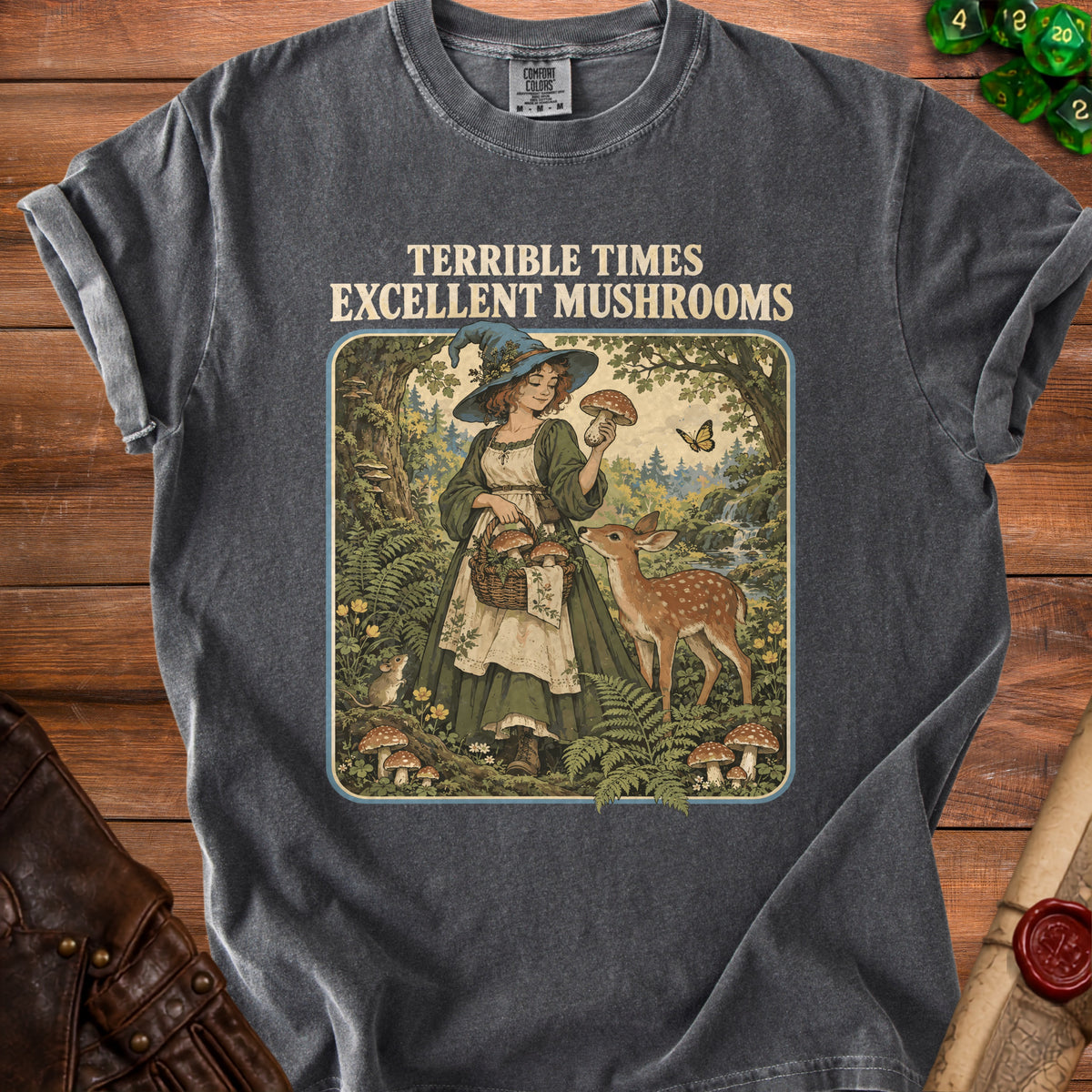 Dark grey t-shirt with "Terrible Times Excellent Mushrooms" graphic of a witch and fawn.