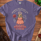 Purple t-shirt with cartoon potato wearing crown and holding poof, text reads "SO I'M JUST SHOCKED AS YOU ARE."