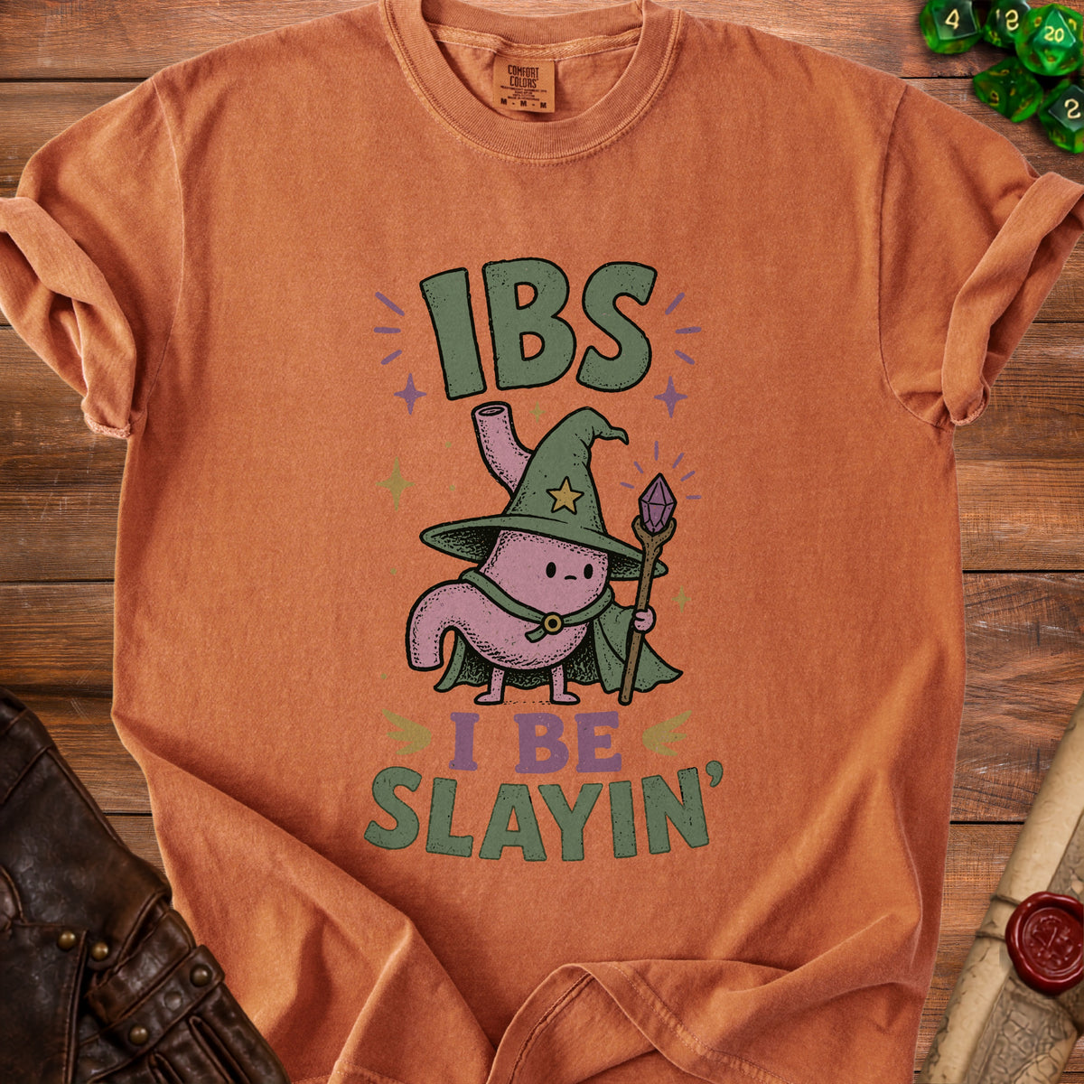 Orange t-shirt with "IBS I BE SLAYIN'" and cartoon stomach wizard graphic.