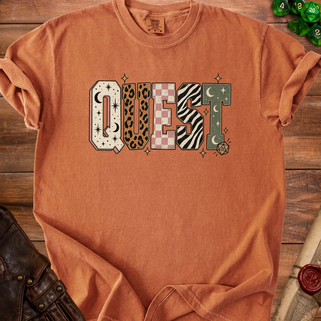 Comfort Colors t-shirt with the word "QUEST" in patterned letters and a dice graphic.