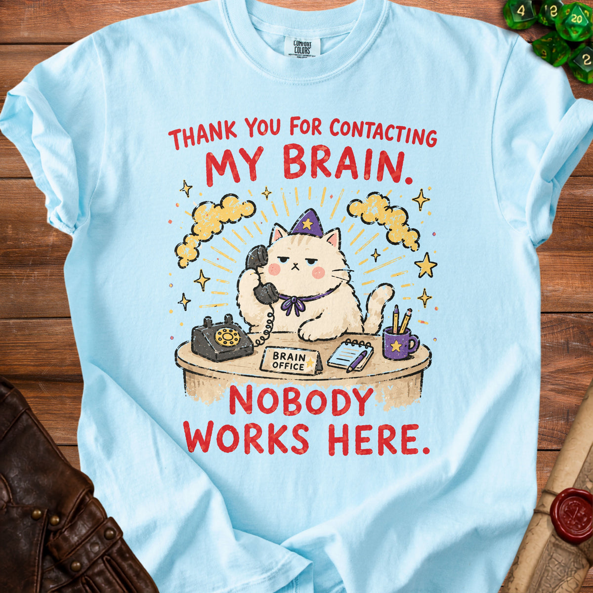 Light blue t-shirt with graphic: cat on phone, "MY BRAIN. NOBODY WORKS HERE."