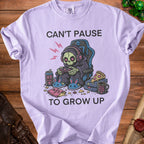 Skeleton grim reaper in gaming chair with "Can't Pause to Grow Up" text.