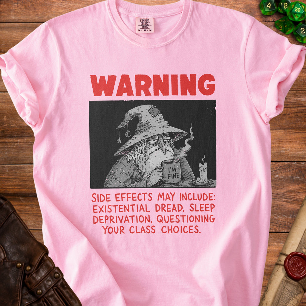Pink t-shirt with a wizard graphic and text warning side effects.