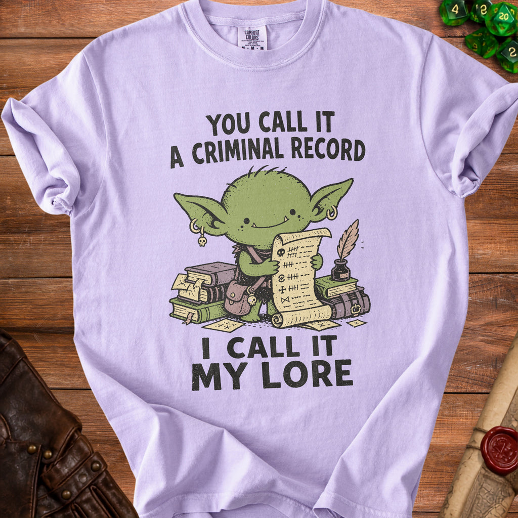 T-shirt with a goblin holding a scroll and books, text reads "You call it a criminal record, I call it my lore."