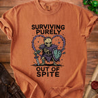 T-shirt with graphic of skeleton warrior and text "Surviving Purely Out of Spite."