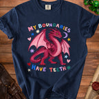 Dark blue t-shirt with pink dragon graphic and text "MY BOUNDARIES HAVE TEETH".