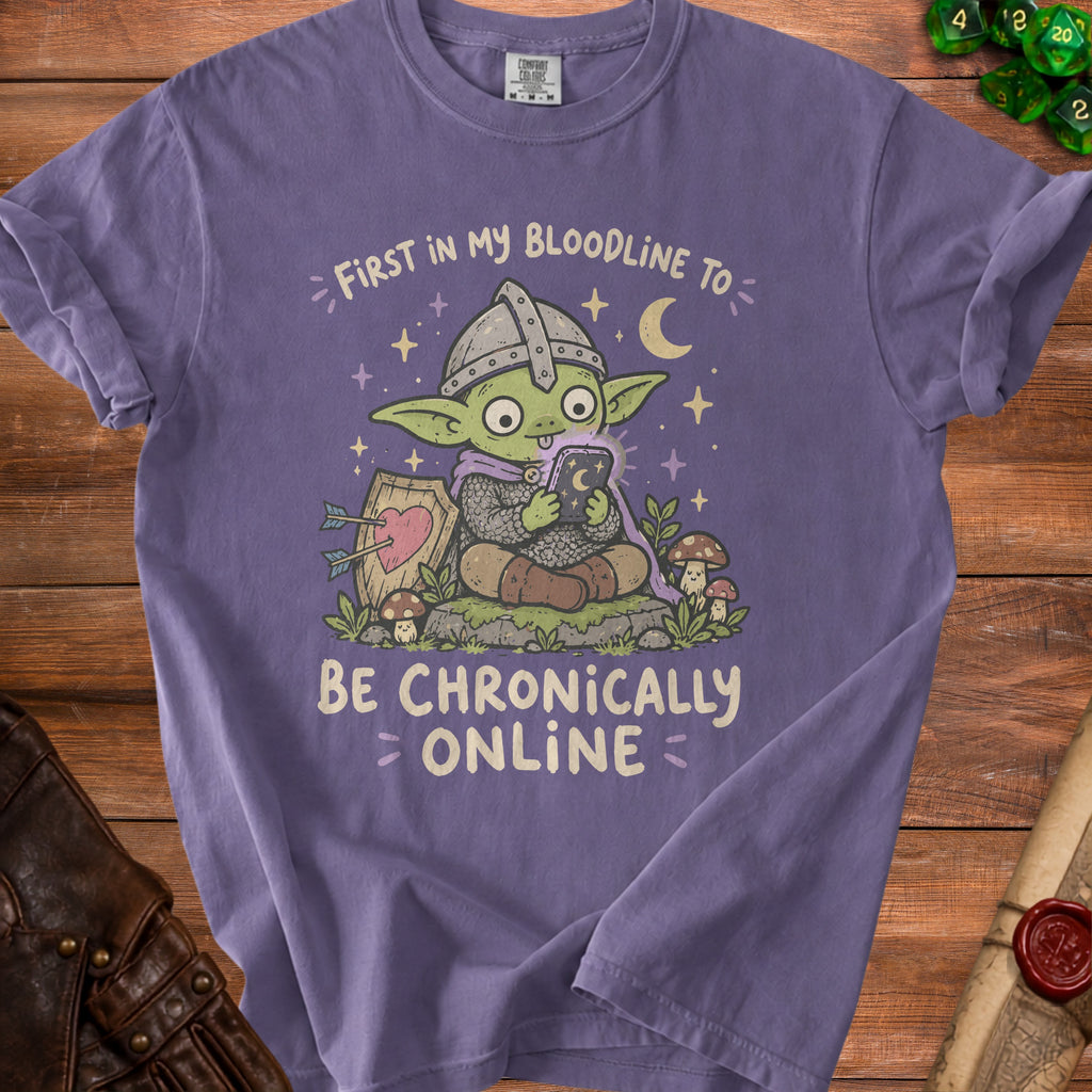 Purple t-shirt with a cartoon goblin knight looking at a phone.