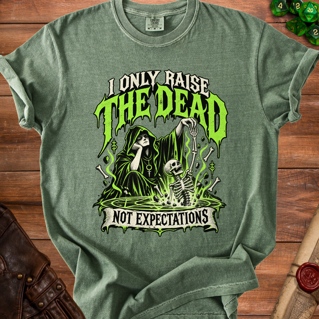 Green t-shirt with Grim Reaper graphic and text "I ONLY RAISE THE DEAD NOT EXPECTATIONS".