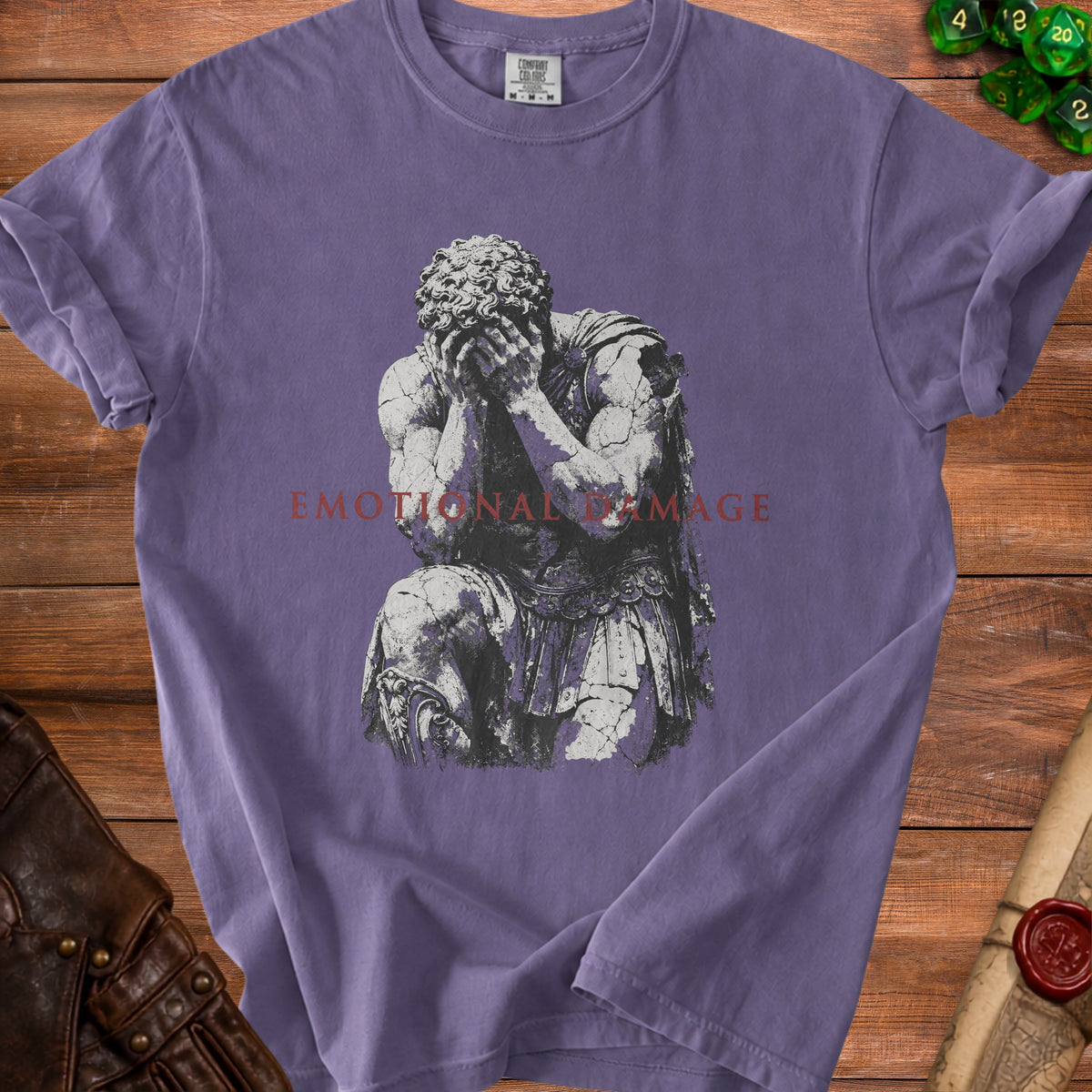 Purple t-shirt with distressed Roman statue graphic and text "EMOTIONAL DAMAGE".