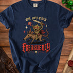 Goblin riding a rat with sword, text "ON MY OWN FREAKUENCY" and skull accents.