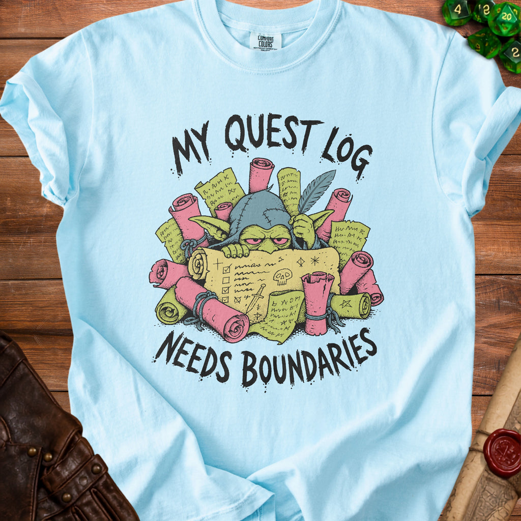 Light blue t-shirt with goblin illustration and text "My Quest Log Needs Boundaries."