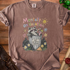 T-shirt graphic of raccoon in trash can with "Out of Office Forever" sign.