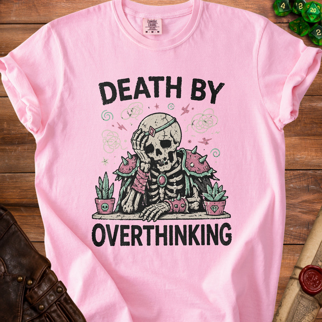 Pink t-shirt with skeleton graphic and text "DEATH BY OVERTHINKING".