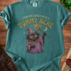T-shirt with a black cat wizard graphic and the text "Forever Cursed With A Tummy Ache".