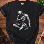 Black t-shirt with a seated knight graphic and "Emotionally Medieval" text.
