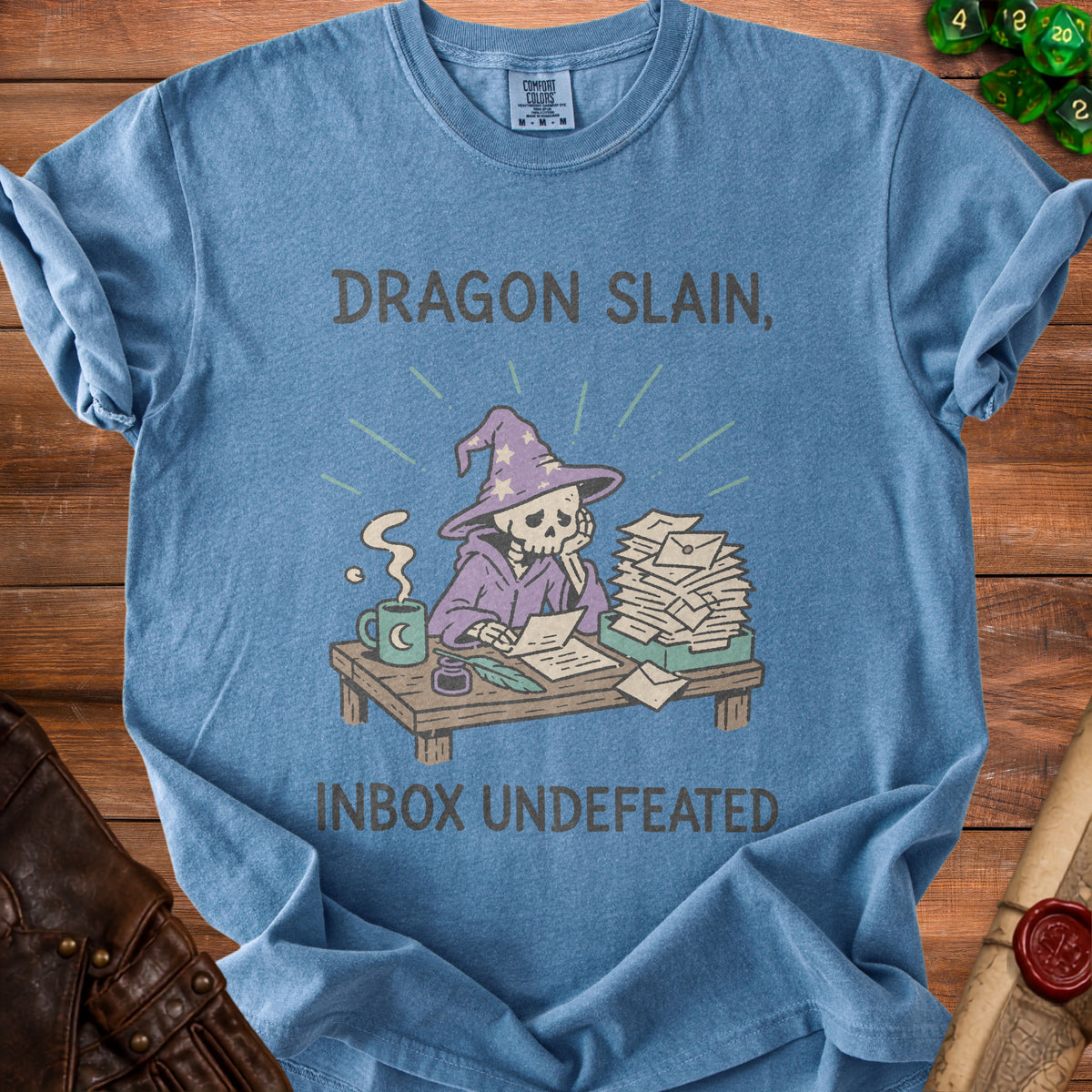 Blue t-shirt with skeleton wizard, overflowing inbox, and text "Dragon Slain, Inbox Undefeated".