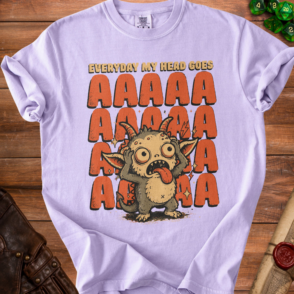Lavender t-shirt with a creature and "EVERYDAY MY HEAD GOES AAAAA" text.