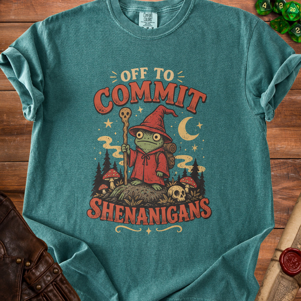 Teal t-shirt with a frog wizard graphic saying "Off to Commit Shenanigans".