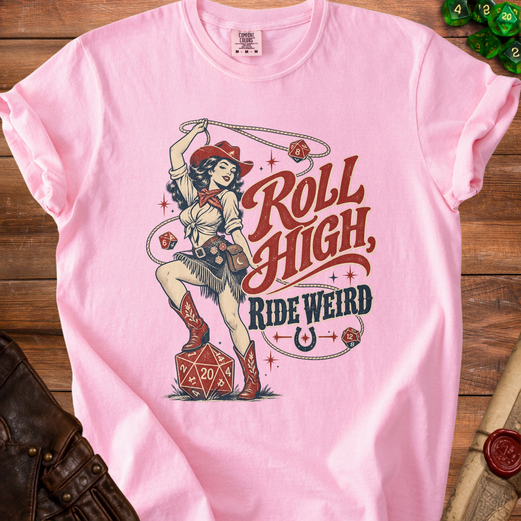 Pink t-shirt with cowboy pin-up graphic saying "Roll High, Ride Weird".