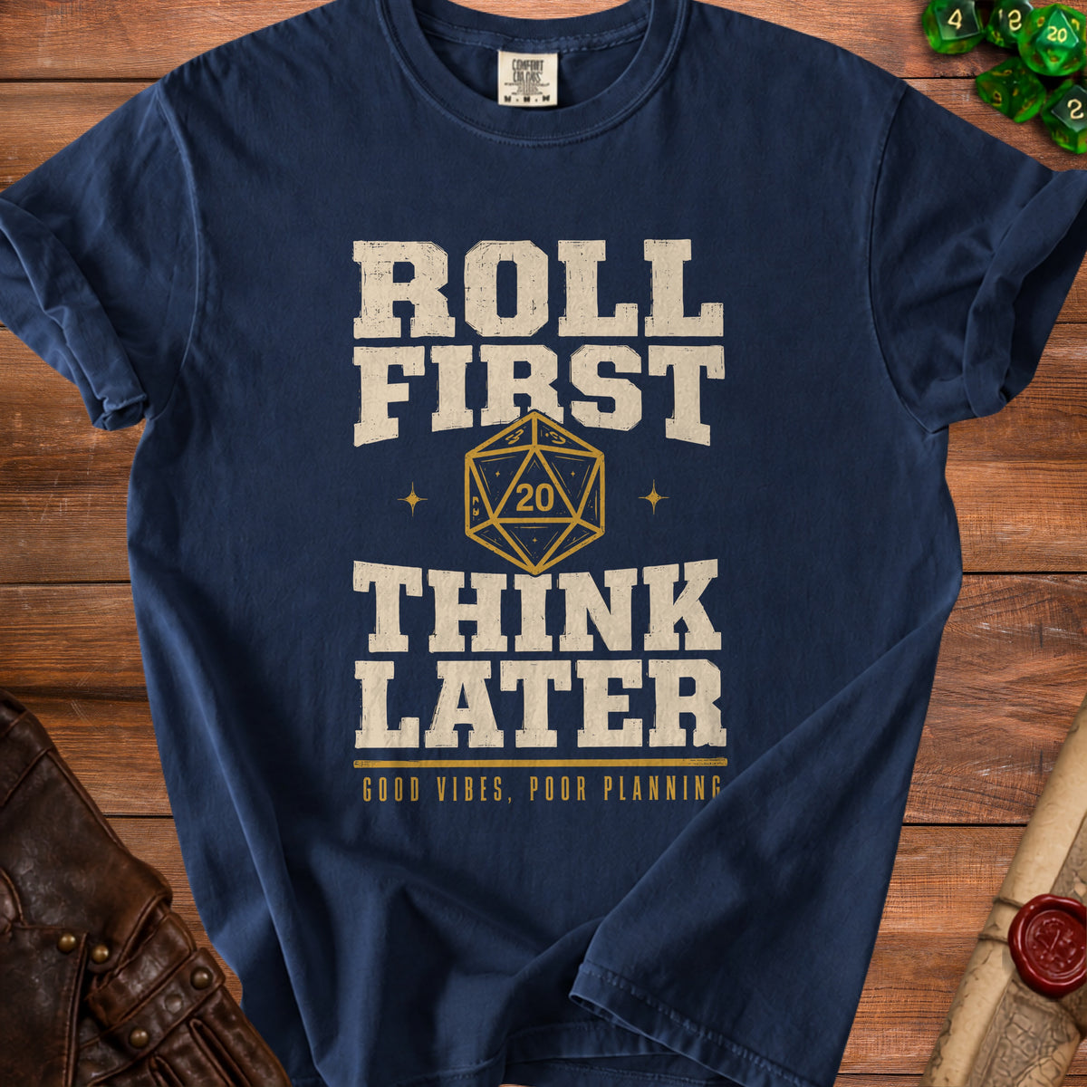 Navy t-shirt with "Roll First Think Later" text and a D20 dice graphic.