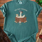Teal t-shirt with a goose wearing a wizard hat and holding a scroll, with dice and dungeon master screen.