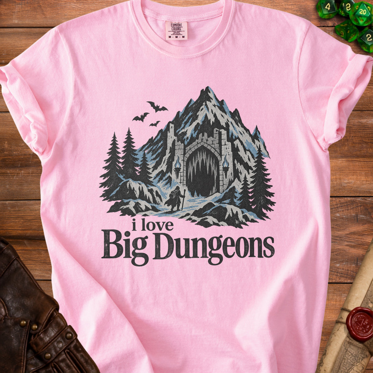 Pink t-shirt with a graphic of a dungeon entrance and the text "i love Big Dungeons".