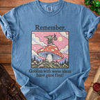 Blue t-shirt with goblin on mushroom graphic, reading "Remember, Goblins with worse ideas have gone first!"