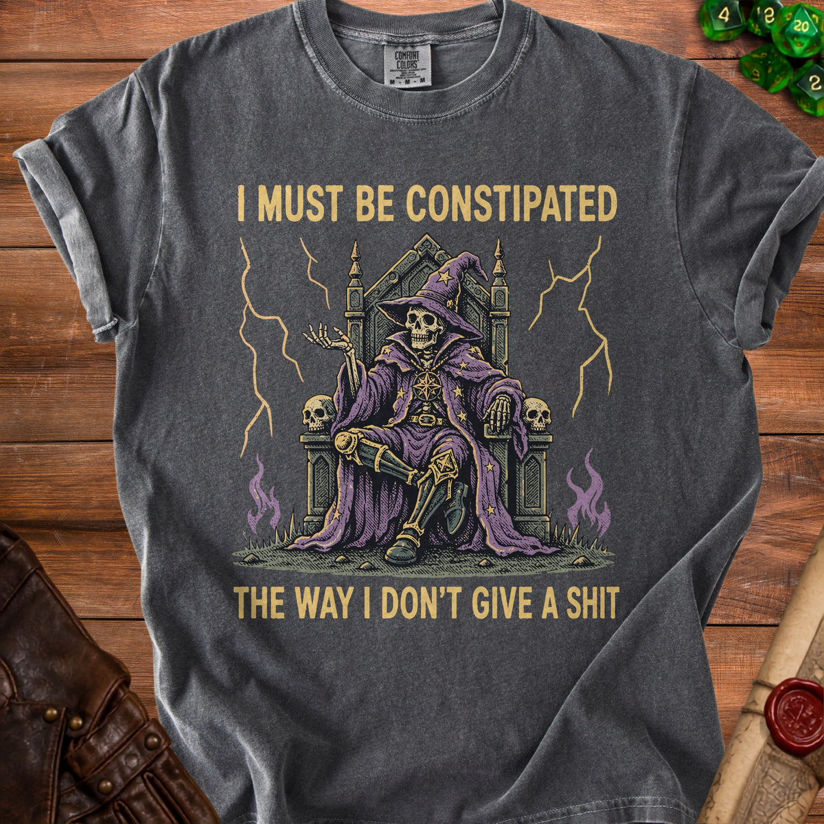 Skeleton wizard on throne with text "I MUST BE CONSTIPATED THE WAY I DON'T GIVE A SHIT".