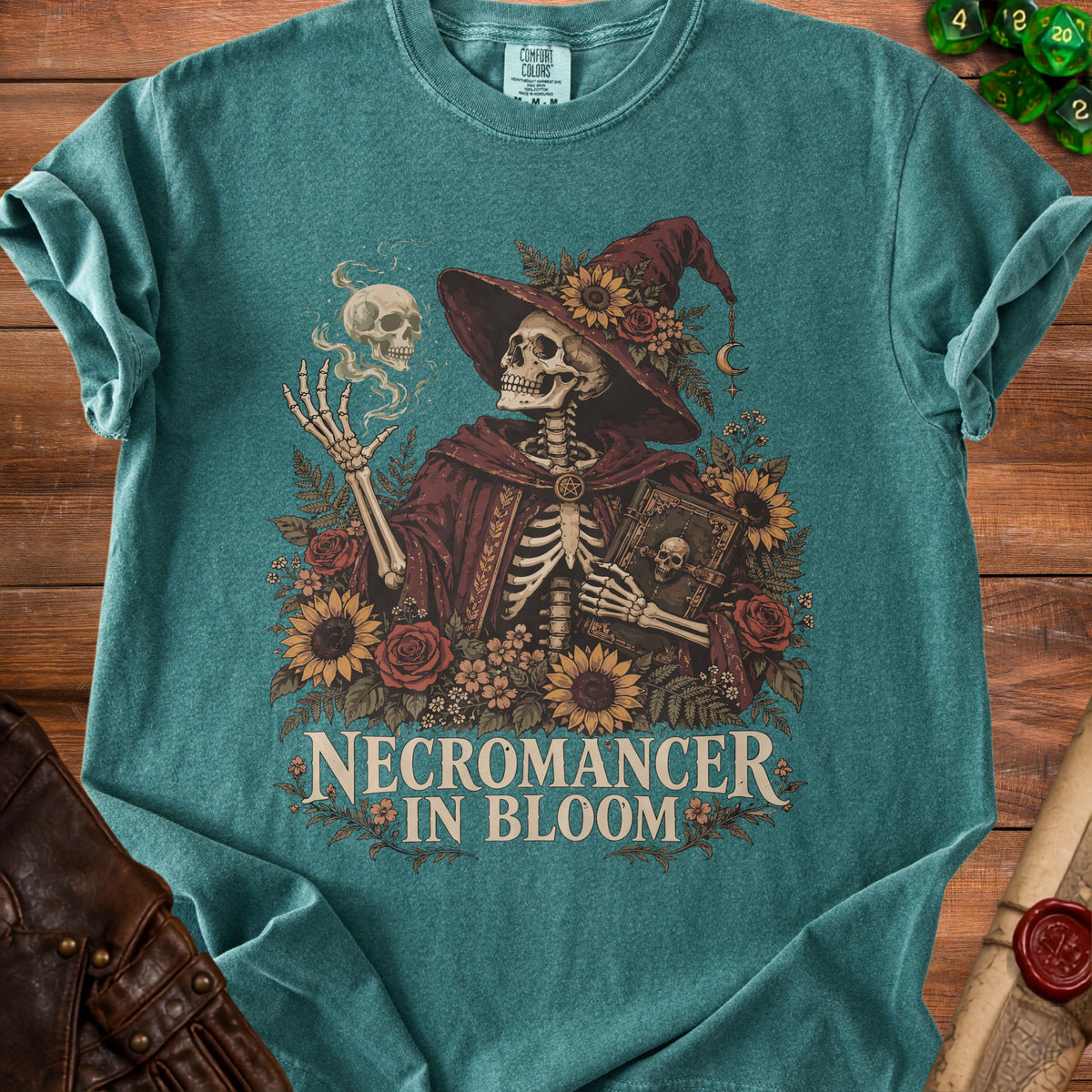 Skeleton wizard with sunflowers and roses, text "Necromancer in Bloom".