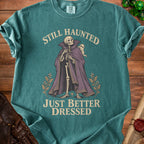 Skeleton in a cape with a ghost, "Still Haunted Just Better Dressed".
