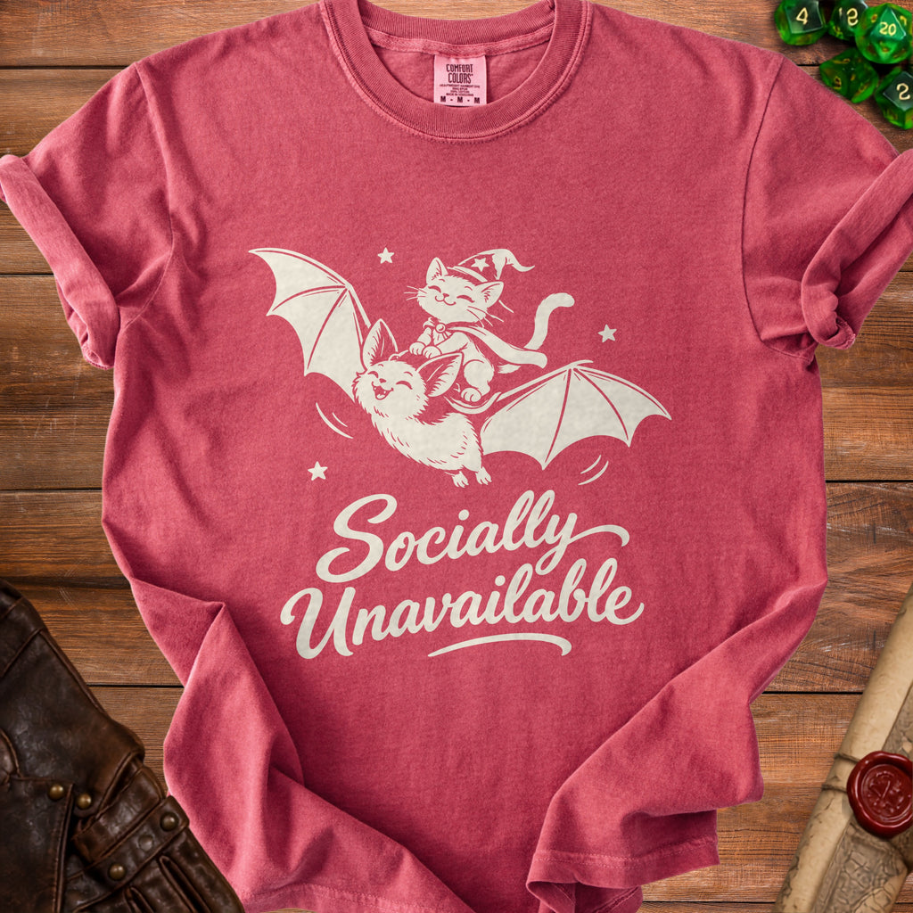 Pink t-shirt with graphic of cat on bat and text "Socially Unavailable".