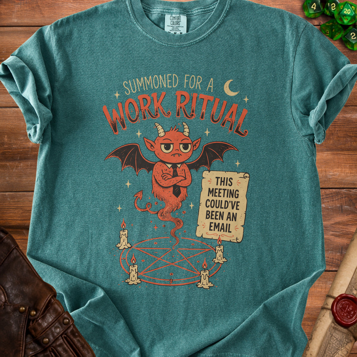Teal t-shirt with a devil graphic holding a sign that reads "This meeting could've been an email".