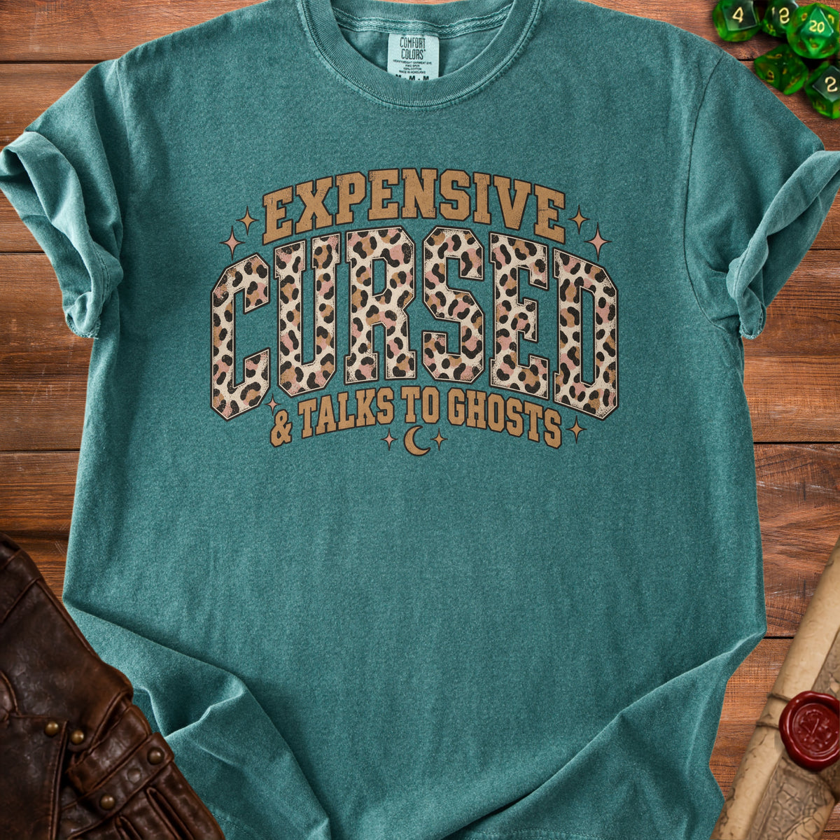 Teal Comfort Colors t-shirt with "Expensive Cursed & Talks to Ghosts" text.