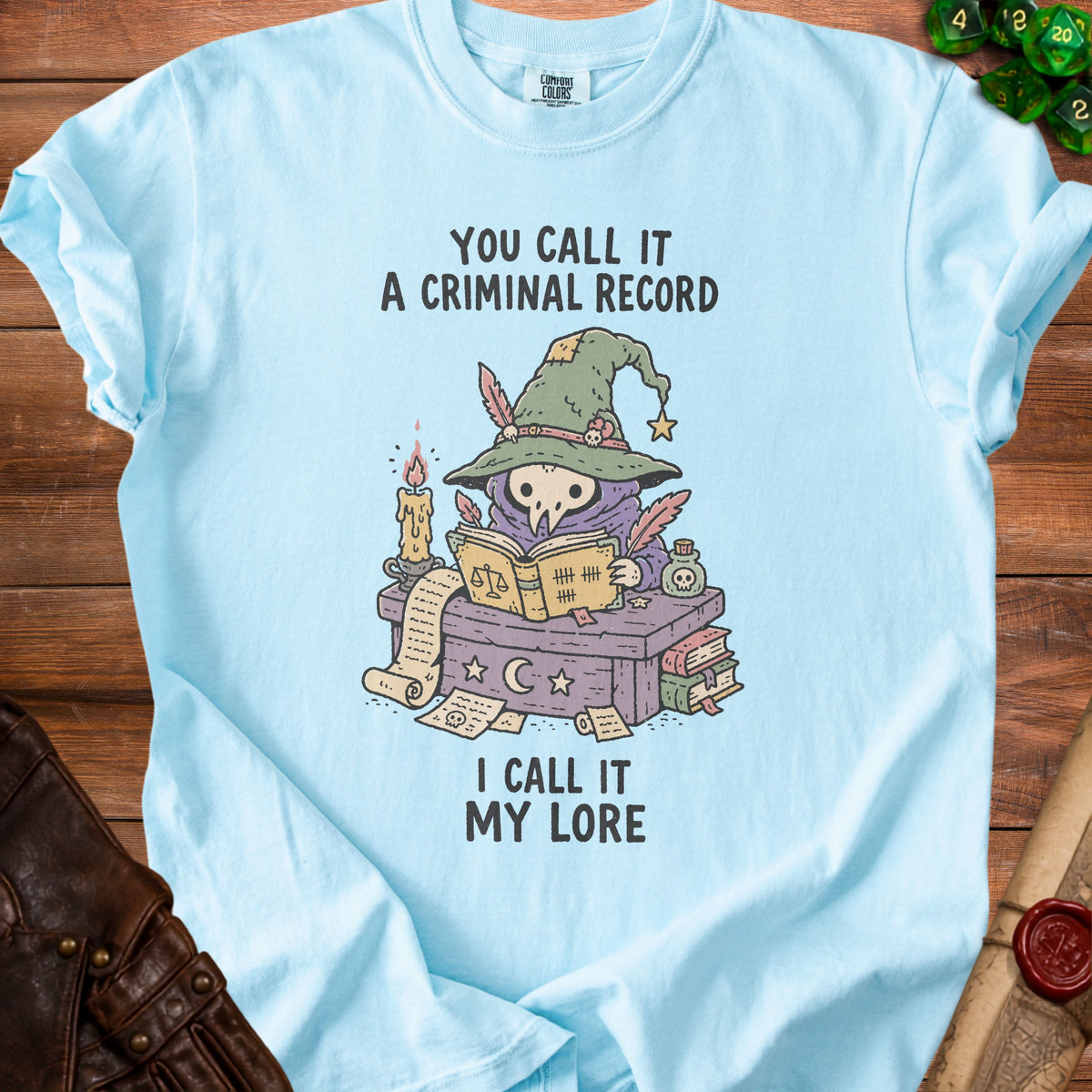 Light blue t-shirt with "You call it a criminal record, I call it my lore."