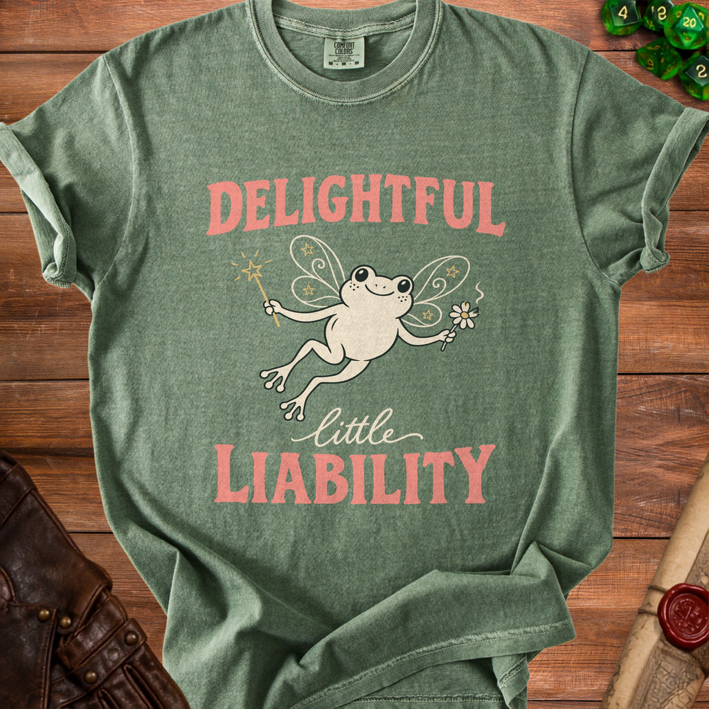 Green t-shirt with a fairy frog graphic and text "Delightful Little Liability".