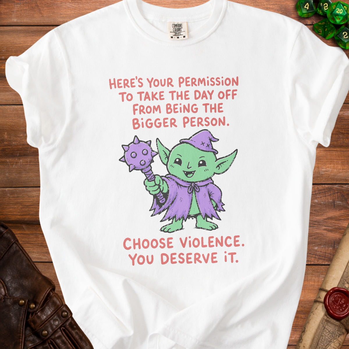 White t-shirt with green goblin graphic and text "Here's your permission to take the day off from being the bigger person. Choose violence. You deserve it."